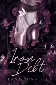 Iron Debt by Lana Dunmore. A dark romance book cover showing pink satin ballet pointe shoes wrapped by a thick black snake, set against dark thorny vines, deep pink chrysanthemum flowers, and butterflies.