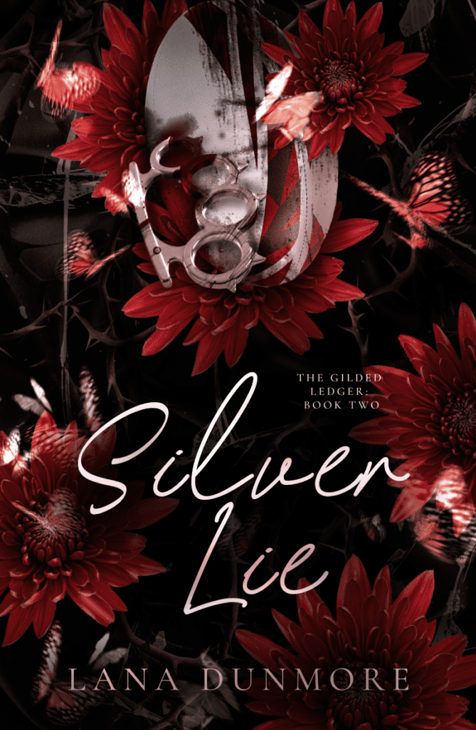 Silver Lie by Lana Dunmore. A dark romance book cover depicting a rugby ball and metallic brass knuckles covered in blood, surrounded by red flowers, thorny brambles, and flying butterflies.